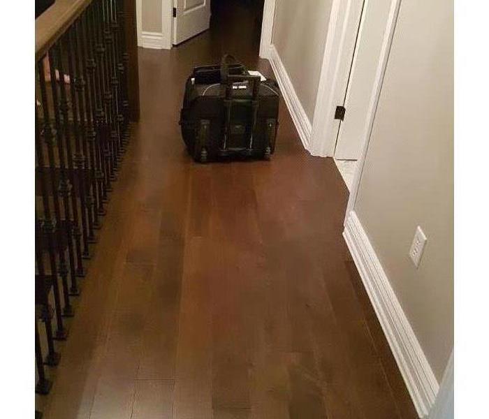 hardwood floor with briefcase on it